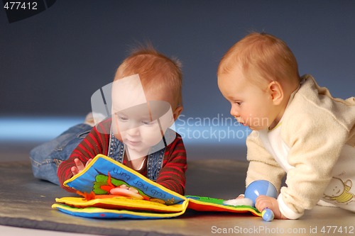 Image of Babies playing with toys