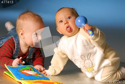 Image of Babies playing with toys