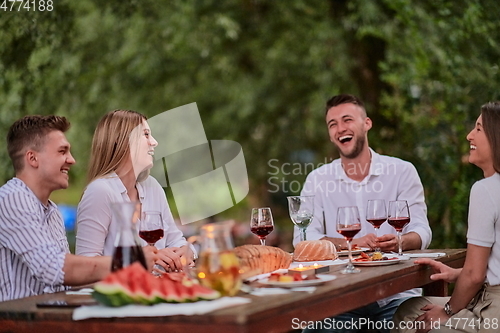 Image of french dinner party on summer