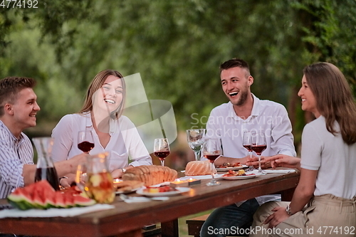 Image of french dinner party on summer
