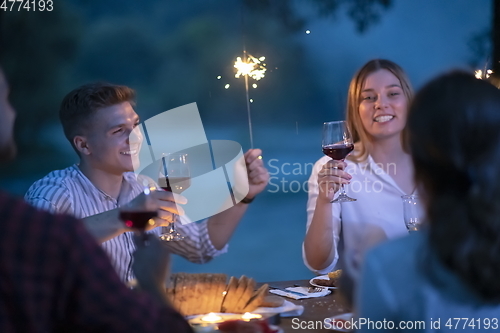 Image of french dinner party on summer