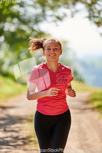 Image of woman enjoying in a healthy lifestyle while jogging