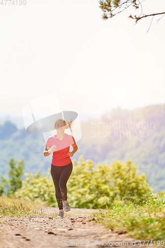 Image of woman enjoying in a healthy lifestyle while jogging