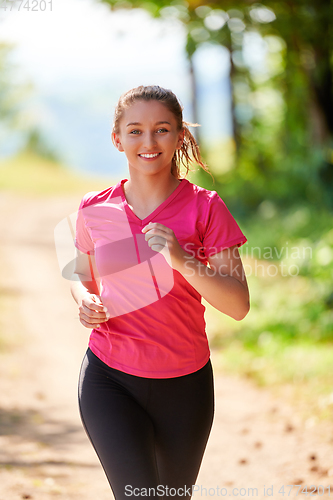 Image of woman enjoying in a healthy lifestyle while jogging