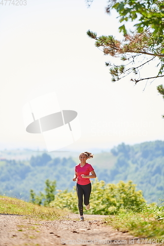 Image of woman enjoying in a healthy lifestyle while jogging