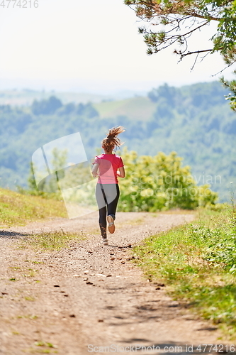 Image of woman enjoying in a healthy lifestyle while jogging