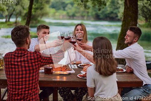 Image of french dinner party on summer