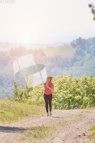 Image of woman enjoying in a healthy lifestyle while jogging