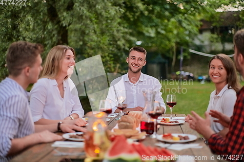 Image of french dinner party on summer