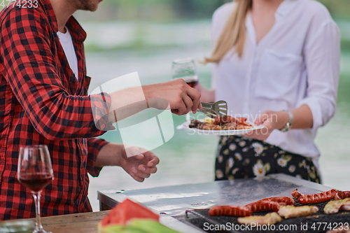 Image of man cooking tasty food for french dinner party