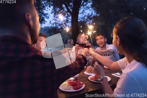 Image of french dinner party on summer