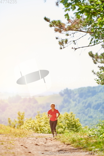 Image of woman enjoying in a healthy lifestyle while jogging