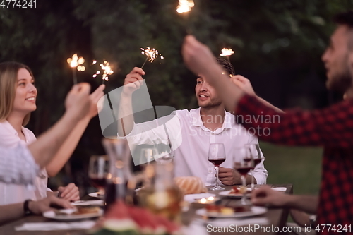 Image of french dinner party on summer