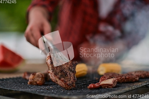 Image of man cooking tasty food for french dinner party