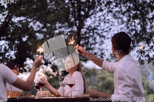 Image of french dinner party on summer
