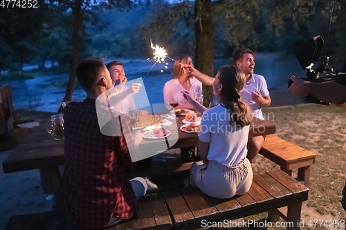 Image of french dinner party on summer