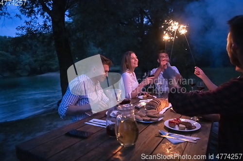 Image of french dinner party on summer