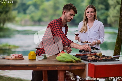 Image of man cooking tasty food for french dinner party