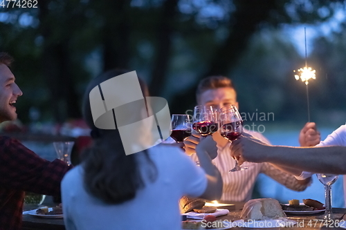 Image of french dinner party on summer