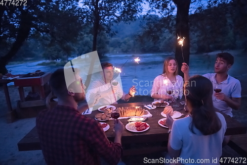 Image of french dinner party on summer