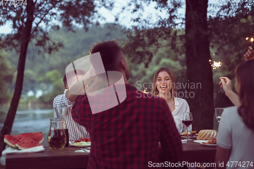 Image of french dinner party on summer