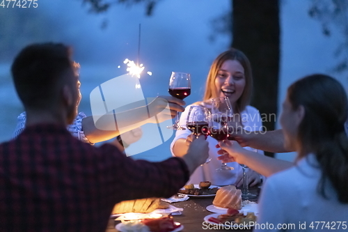 Image of french dinner party on summer