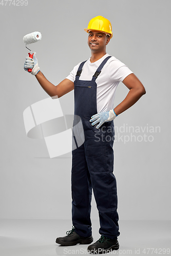 Image of happy indian painter or builder with paint roller