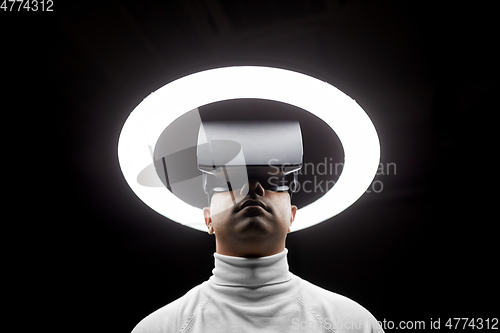 Image of man in virtual reality headset or vr glasses
