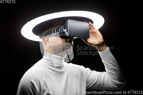 Image of man in virtual reality headset or vr glasses