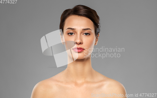 Image of beautiful young woman with bare shoulder