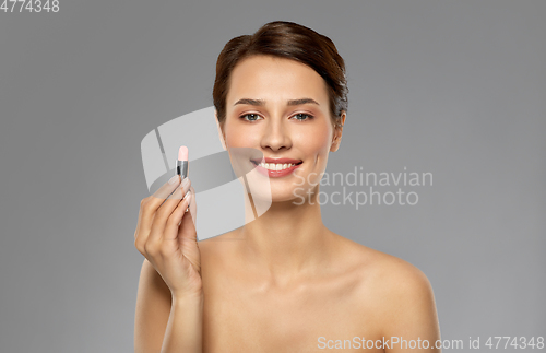 Image of beautiful smiling young woman with pink lipstick