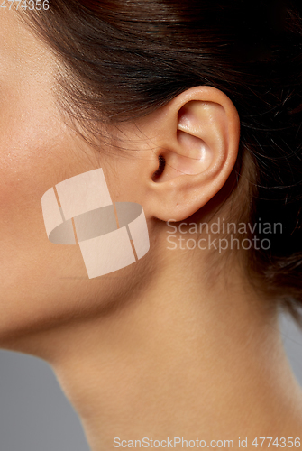 Image of close up of young woman ear