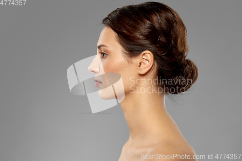 Image of profile of beautiful woman with bare shoulders