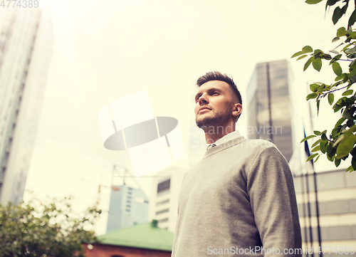 Image of young man on city street