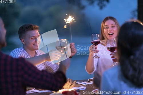 Image of french dinner party on summer