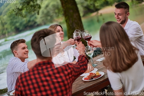 Image of french dinner party on summer