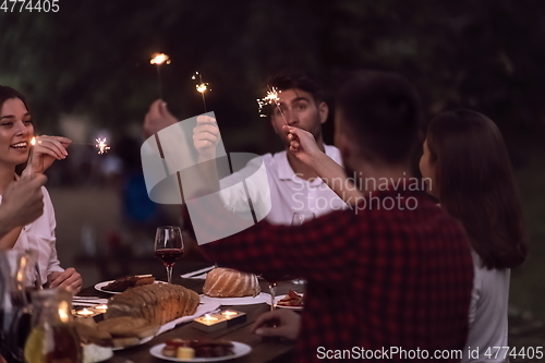 Image of french dinner party on summer