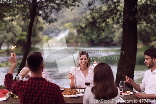 Image of french dinner party on summer