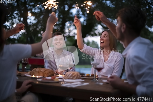 Image of french dinner party on summer