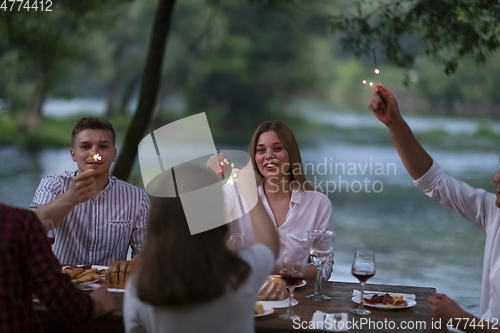 Image of french dinner party on summer