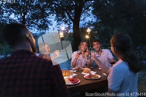 Image of french dinner party on summer