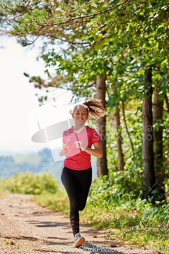 Image of woman enjoying in a healthy lifestyle while jogging