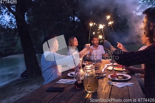 Image of french dinner party on summer