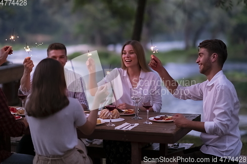 Image of french dinner party on summer