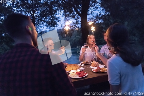 Image of french dinner party on summer