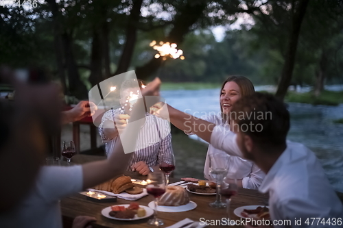 Image of french dinner party on summer