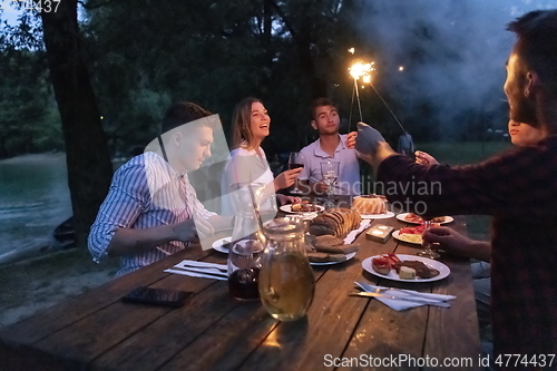 Image of french dinner party on summer
