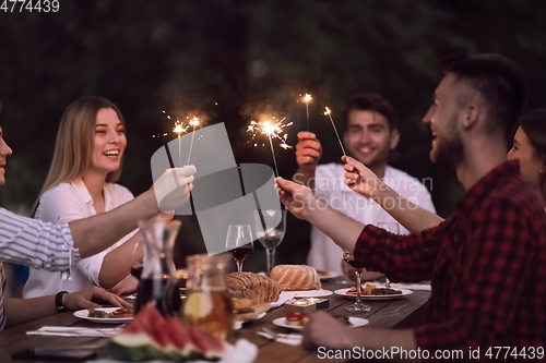 Image of french dinner party on summer