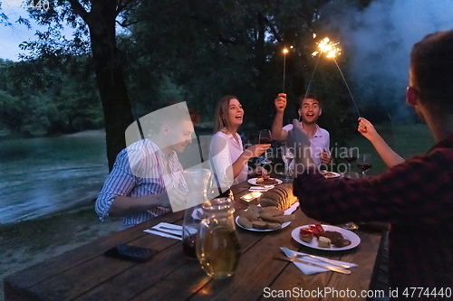 Image of french dinner party on summer