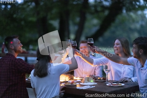 Image of french dinner party on summer